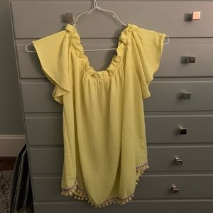 Off the shoulder yellow top with Pom poms